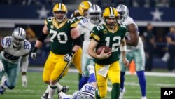 Green Bay Packers' Aaron Rodgers runs during the second half of an NFL divisional playoff football game against the Dallas Cowboys Sunday, Jan. 15, 2017, in Arlington, Texas.