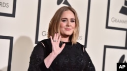FILE - Adele arrives at the 58th annual Grammy Awards at the Staples Center on Feb. 15, 2016, in Los Angeles. 