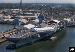 The USS Gerald R. Ford is seen at Newport News Shipbuilding in Newport News, Virginia, April 27, 2016. The $13 billion warship, the first of the Navy’s next generation of aircraft carriers, is in the final stages of construction after delays and cost over