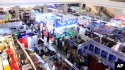 FILE - People attend the 20th Pyongyang Spring International Trade Fair in Pyongyang, North Korea, May 22, 2017. Countries participating in the fair include Belarus, China, Iran, Italy, Indonesia, Vietnam and Cuba.