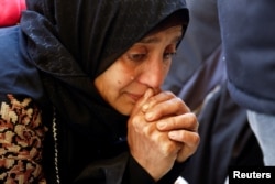 A Palestinian woman mourns at a hospital after an Israeli strike killed three policemen, according to the Hamas-run interior ministry, in Khan Younis, southern Gaza Strip, Feb. 16, 2025.