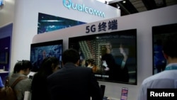 A Qualcomm sign is seen at the 2ns China International Import Expo (CIIE) in Shanghai, Nov. 6, 2019. 