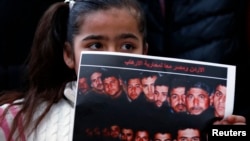 کچێک وینه‌ی 21 مه‌سیحی میسری پێ یه‌ که‌ 17ی مانگی 2 له‌ لیبی داعش سه‌ری بڕین.