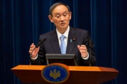 PM Jepang Yoshihide Suga dalam konferensi pers di Tokyo, Jepang, 5 Maret 2021. (Yuichi Yamazaki/Pool via AP)