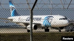 A hijacked Egypt Air A320 airbus stands on the runway at Larnaca Airport in Larnaca, Cyprus , March 29, 2016. REUTERS/Yiannis Kourtoglou