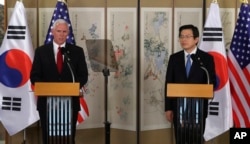 U.S. Vice President Mike Pence, left, speaks as South Korea's acting President and Prime Minister Hwang Kyo-ahn listens during a joint news conference after their meeting in Seoul, South Korea, Monday, April 17, 2017.