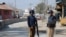 Policemen keep guard near the central prison where a court convicted 31 people over the campus lynching of a university student last year who was falsely accused of blasphemy, in Haripur, Pakistan, Feb. 7, 2018.