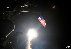 FILE - U.S. cruise missiles are launched from the guided-missile destroyer USS Porter from the Mediterranean Sea, April 7, 2017, targeting an air base in Syria in retaliation for an chemical attack allegedly perpetrated by the Syrian regime. Observers say President Donald Trump should use his upcoming meeting with Russian President Vladimir Putin to draw clear lines on Syria and Ukraine.