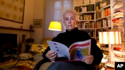 Lucetta Scaraffia, editor in chief of "Donne, Chiesa, Mondo" (Women, Church, World), poses for portraits in her house in Rome, Wednesday, Feb. 28, 2018. (AP Photo/Domenico Stinellis)