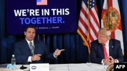 Arhivska fotografija, Ron DeSantis (lijevo) i Donald Trump