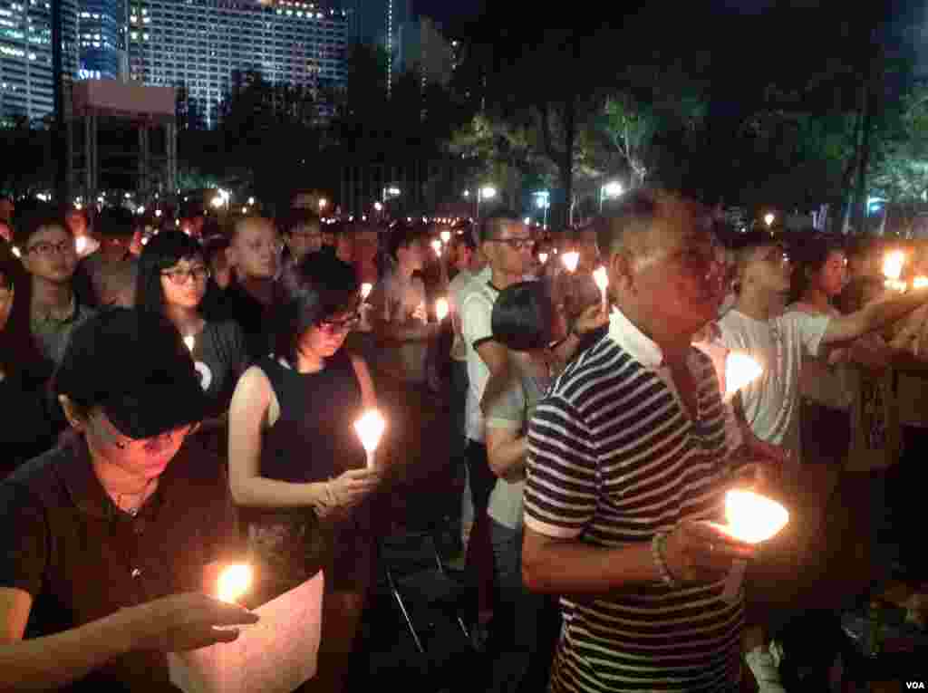 People attend an annual candlelight vigil at Victoria Park in Hong Kong June 4, 2015 to mark Beijing's Tiananmen Square crackdown in 1989.