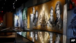 An exhibit discussing slavery and the Bible in the United States is displayed inside the Museum of the Bible, Monday, Oct. 30, 2017, in Washington. (AP Photo/Jacquelyn Martin)