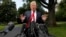 President Donald Trump speaks to the media on the South Lawn of the White House in Washington, May 23, 2018, en route to a day trip to New York. 