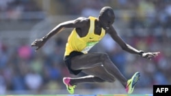 FILE - Uganda's Benjamin Kiplagat competes in the Men's 3000m Steeplechase Round 1 during the athletics event at the Rio 2016 Olympic Games at the Olympic Stadium in Rio de Janeiro on Aug. 15, 2016.