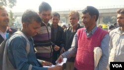 Ishwari Lal, who works at a construction site, has been told by his building contractor that he will pay his wages in a bank account due to currency shortages.