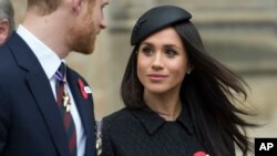 Britain's Prince Harry and Meghan Markle attend a Service of Thanksgiving and Commemoration on ANZAC Day at Westminster Abbey in London, April 25, 2018. 