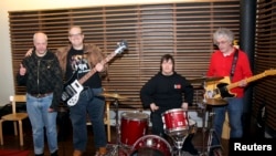 Life is good for senior citizens in Finland. Here, members of the Finnish punk band Pertti Kurikan Nimipaivat, all nearing their 60s, continue to rock on. (FILE PHOTO/March 2015.)