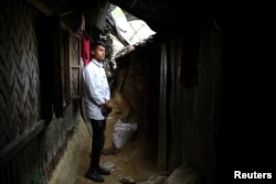 Kefayat Ullah, a Rohingya boy who was expelled from Leda High School for being a Rohingya, poses for a picture in front of his shelter in Leda camp in Teknaf, Bangladesh, March 5, 2019. REUTERS/Mohammad Ponir Hossain