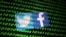 FILE - The Twitter and Facebook logos are seen with binary cyber codes in this illustration, Nov. 26, 2019. 