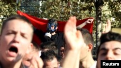 Demonstrators protest against the potential dismantling of Syrian chemical weapons in Albania in front of the Parliament in Tirana, Nov. 14, 2013.