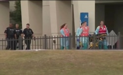 This photo taken from video provided by WEAR-TV shows emergency responders near the Naval Air Base Station in Pensacola, Fla., Dec. 6, 2019.