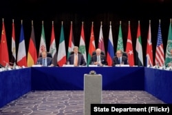 U.S. Secretary of State John Kerry sits with Russian Foreign Minister Sergey Lavrov, United Nations Special Envoy for Syria Staffan de Mistura, and UN Deputy Secretary-General Jan Eliasson on Feb. 11, 2016, at the Hilton Hotel join Munich, Germany.
