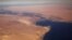 FILE - The Suez Canal connecting the Mediterranean Sea to the Red Sea is pictured from the window of a commercial plane flying over Egypt.