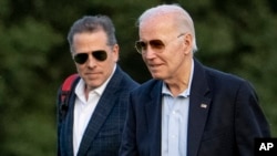 FILE - President Joe Biden, and his son Hunter Biden arrive at Fort McNair, in Washington, June 25, 2023.