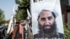 FILE - A poster of Taliban supreme leader Hibatullah Akhundzada is seen along a road in Kabul, Afghanistan, on Aug. 14, 2023. 