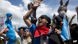 Los guatemaltecos manifestaron el jueves, 20 de septiembre de 2018 para exigir al presidente que mantenga a la Comisión Internacional Contra la Impunidad en Guatemala (CICIG).