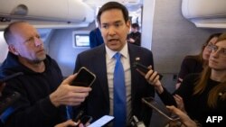 US Secretary of State Marco Rubio speaks with the media on his military airplane as he flies to Jeddah, Saudi Arabia, March 10, 2025. 