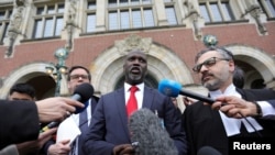 Gambia's Justice Minister Abubacarr Tambadou talks to the media outside the International Court of Justice (ICJ), after the ruling in a case filed by Gambia against Myanmar alleging genocide against the minority Muslim Rohingya population, in The Hague, N