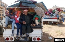Syrian refugees prepare to return to Syria from the Lebanese border town of Arsal, Lebanon, June 28, 2018.