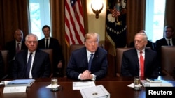 U.S. President Donald Trump speaks during a cabinet meeting, flanked by Secretary of State Rex Tillerson (L) and Secretary of Defense James Mattis (R), at the White House in Washington, U.S., November 1, 2017. REUTERS/Kevin Lamarque
