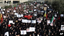 Iranian protesters chant slogans at a rally in Tehran, Iran, Dec. 30, 2017. 
