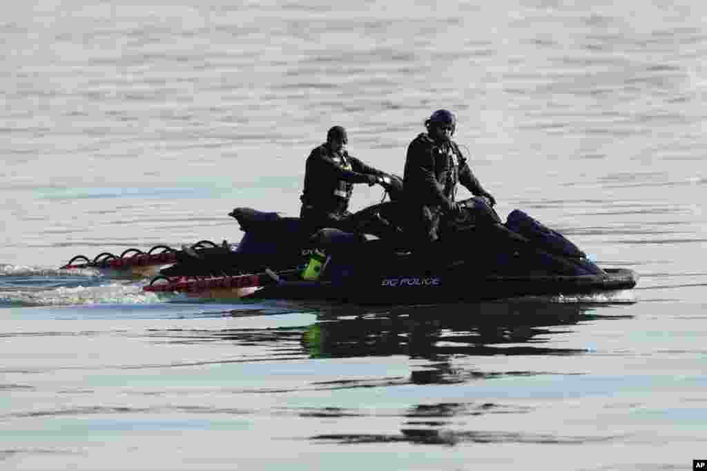 Search and rescue efforts are seen around a wreckage site in the Potomac River from Ronald Reagan Washington National Airport, Jan. 30, 2025, in Arlington, Virginia.