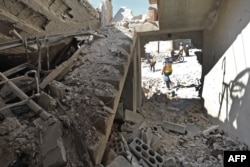 This picture shows destruction reportedly caused by govenrment forces' bombings in the town of al Habit on the southern edges of rebel-held Idlib province on Sept. 10, 2018.