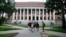 FILE - Students walk near the Widener Library in Harvard Yard at Harvard University in Cambridge, Mass., Aug. 13, 2019.