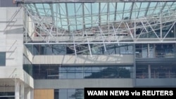 A collapsed building at Curtin University in Perth, Australia October 13, 2020 is seen in this screen grab obtained from a social media video.