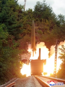 A missile is seen launched during a drill of the Railway Mobile Missile Regiment in North Korea, in this image supplied by North Korea's Korean Central News Agency on September 16, 2021.
