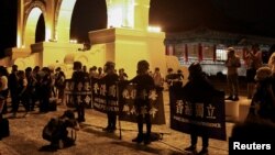 FILE - Hong Kong anti-government demonstrators gather at Liberty Square in Taipei to mark the 31st anniversary of the crackdown of pro-democracy protests at Beijing's Tiananmen Square in 1989, Taiwan, June 4, 2020. (REUTERS/Ann Wang/File)