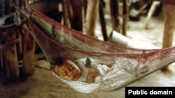 A Honduran baby sleeps in a hammock. The word comes from the Taino word hamaka of the indigenous people of Hispanola. Originally, it meant "stretch of cloth."