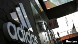 FILE PHOTO - View of an Adidas store in Beijing. According to The Guardian, researchers say an isotope analysis found that shirts by Adidas, Puma, Hugo Boss and Jack Wolfskin contain traces of cotton related to Uyghur forced labor in the Xinjiang region,