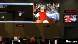 ISRO scientists and engineers watch Prime Minister Narendra Modi.