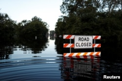 State Road 76 is blocked by flood waters in the aftermath of Hurricane Florence in Fair Bluff, North Carolina, U.S., Sept. 18, 2018.