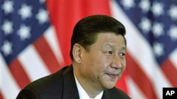 中國國家副主席習近平和美國副總統拜登(不在圖內)於去年8月19日出席在北京飯店舉行的美中貿易領袖會議。