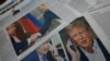 Capas de jornais dedicadas ao telefonema Putin-Trump numa banca de jornais em Moscovo. Fotografia de arquivo
