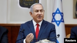 Israeli Prime Minister Benjamin Netanyahu attends the weekly cabinet meeting at his office in Jerusalem, July 8, 2018. 