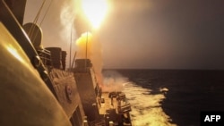 FILE - This handout picture courtesy of the US Navy taken on Oct. 19, 2023, shows USS Carney defeating Houthi missiles in the Red Sea. On Oct. 28, Egypt reported it shot down several drones that it said were sent by Yemen's pro-Iranian Houthi militia. (U.S. Navy via AFP)