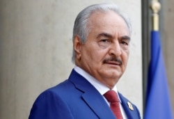 FILE PHOTO: Khalifa Haftar, the military commander who dominates eastern Libya, arrives to attend an international conference on Libya at the Elysee Palace in Paris, May 29, 2018.